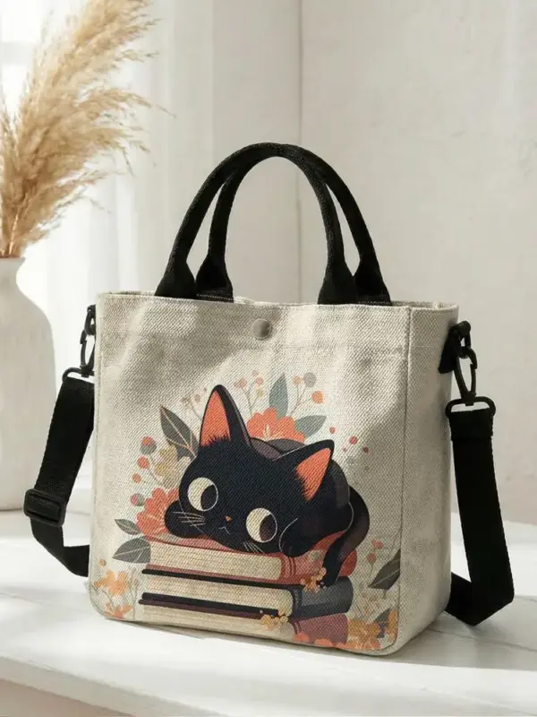 Geschenke für Katzenliebhaber: Handtasche mit Katze auf Büchern
