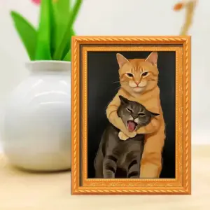 Kühlschrankmagnet im orangen Bilderrahmen mit zwei umarmenden Katzen