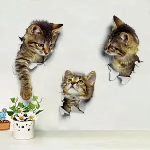 Drei 3D-Katzen-Wandsticker, deren Katzen aus Löchern in einer weißen Wand schauen