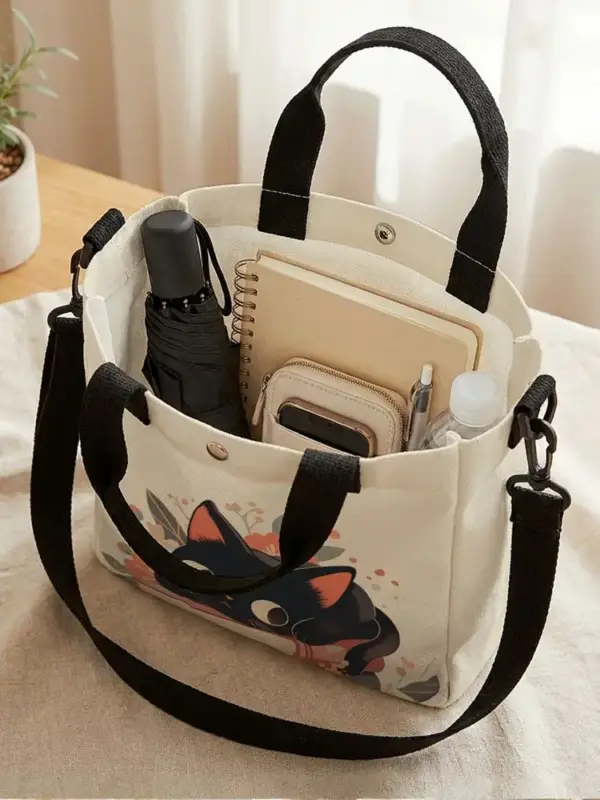 Geschenke für Katzenliebhaber: Handtasche mit Katze auf Büchern – Bild 2
