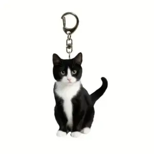 Schlüsselanhänger mit schwarz-weißer Katze, sitzend, flaches Motiv mit Karabiner
